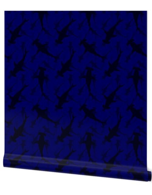 Hammerhead Sharks in Dark Silhouette Circling in Dark Blue Water Wallpaper