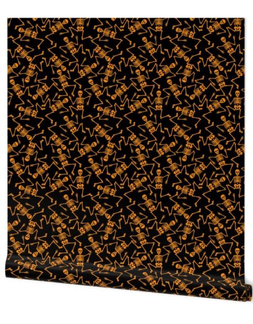 Small Bright Orange Dancing Halloween Skeletons Scattered On Black Wallpaper