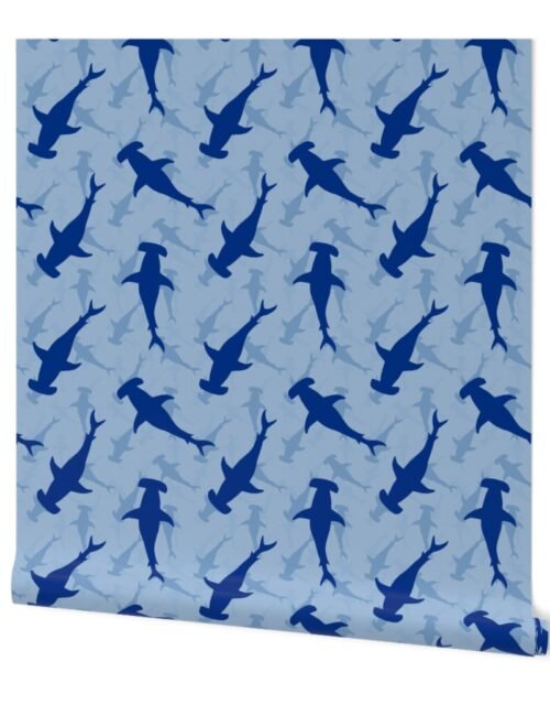 Dark Hammerhead Sharks Silhouette Circling  in Sky Blue Water Wallpaper