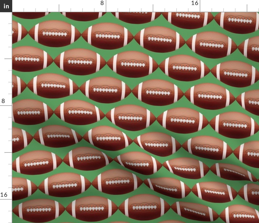 4 inch Gridiron American Pigskin Football with Lacing and Stitching on Field Green Fabric