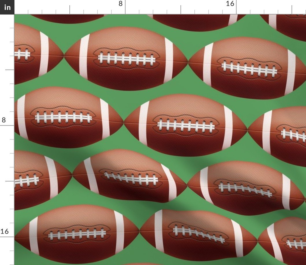 8 inch Gridiron American Pigskin Football with Lacing and Stitching on Field Green Fabric