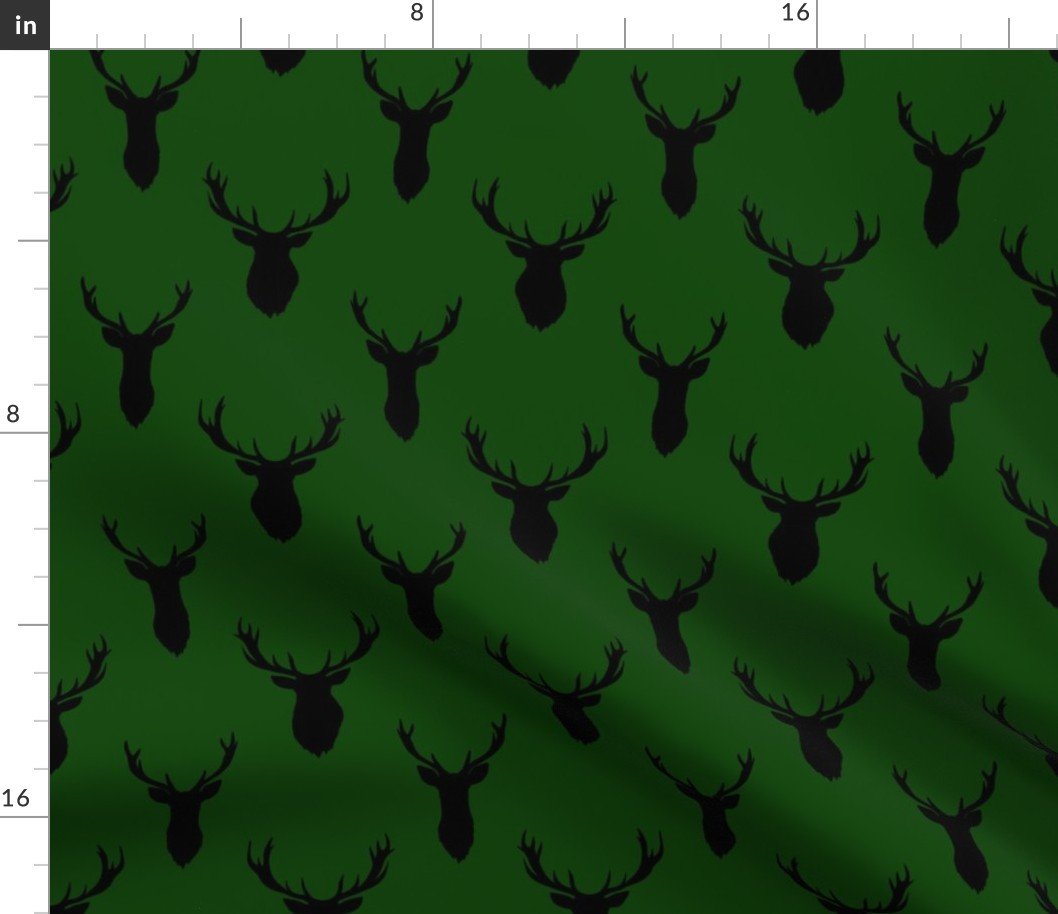 Black Buck Deer Trophy Heads with Antler Racks Mounted on Green Fabric