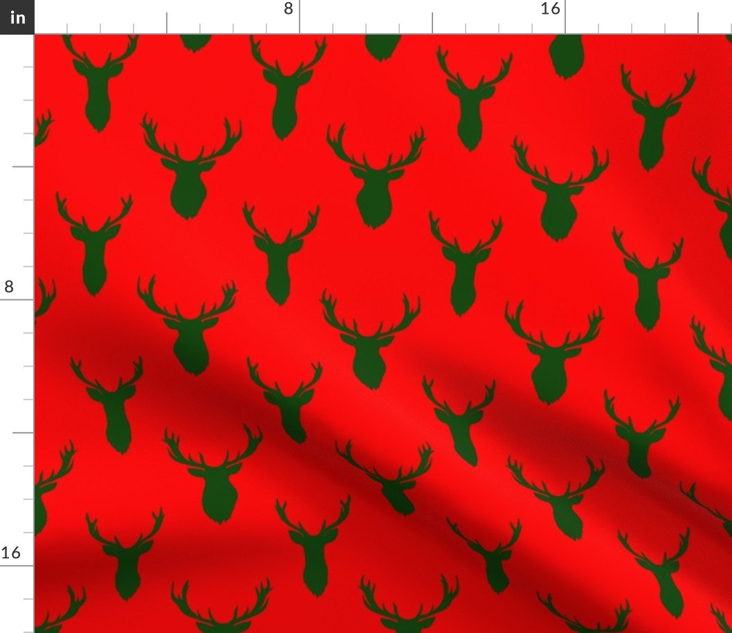 Green Buck Deer Trophy Heads with Antler Racks Mounted on Red Fabric