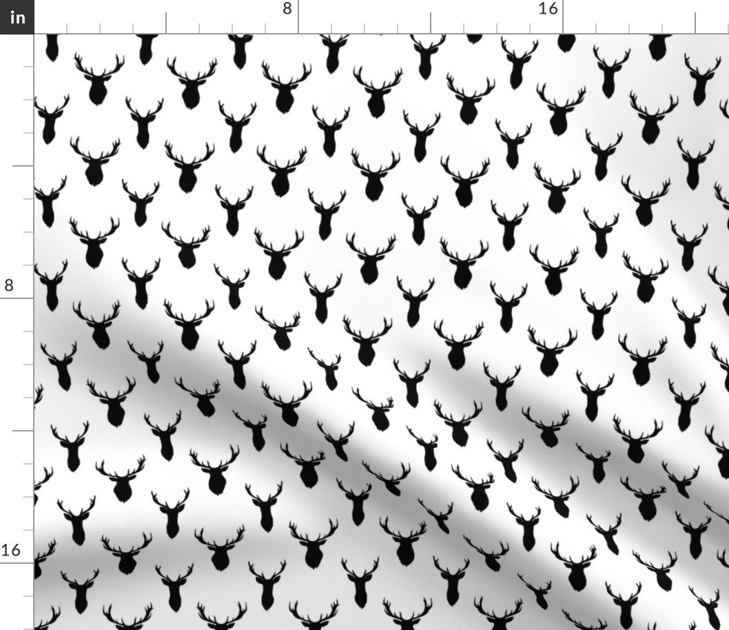 Small Black Buck Deer Trophy Heads with Antler Racks Mounted on White Fabric