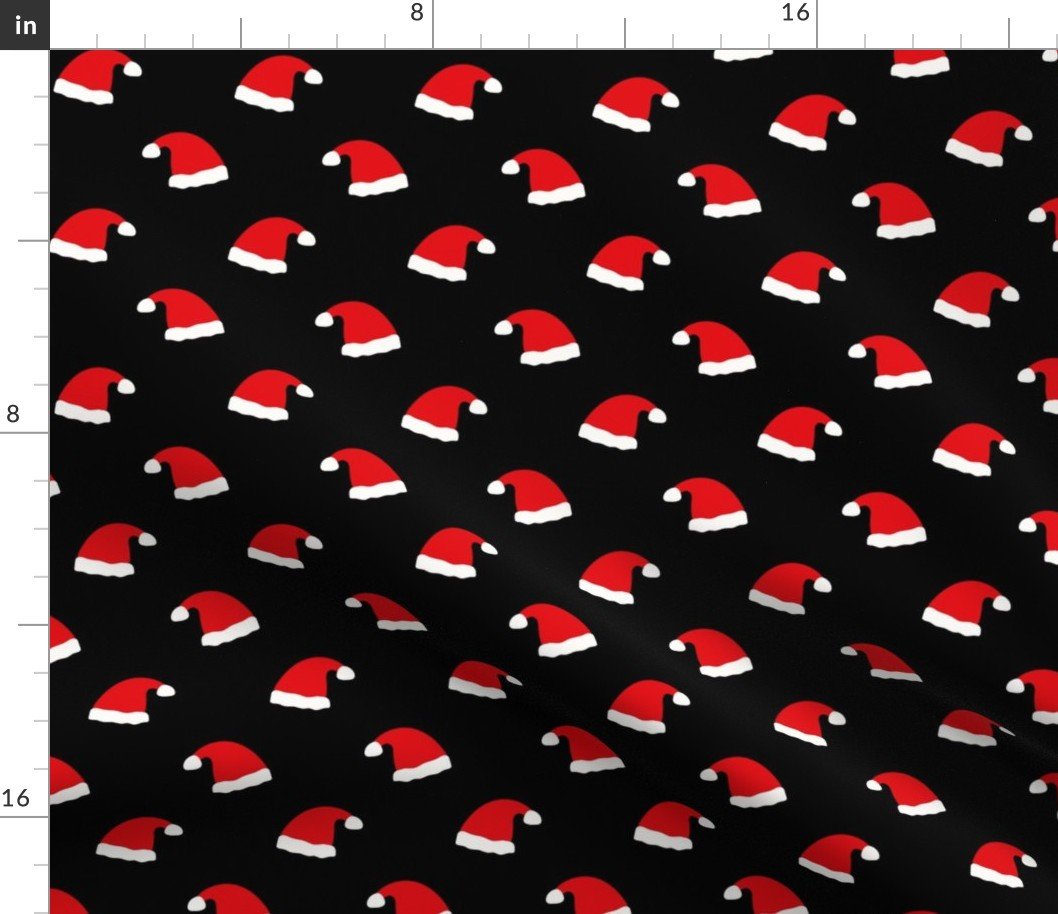 Small Jolly Old Saint Nick Red Santa Christmas Hats on Night Black Fabric